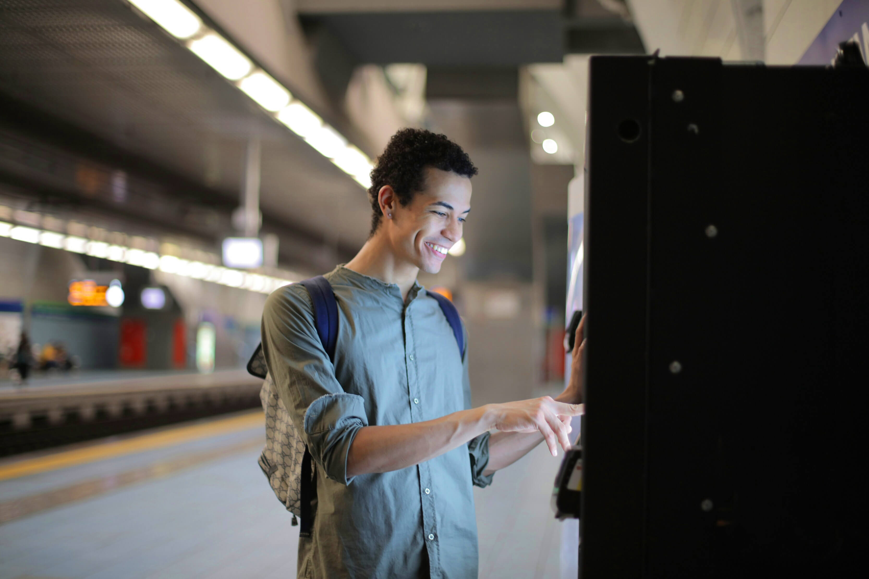 Man buys something from a vending machine